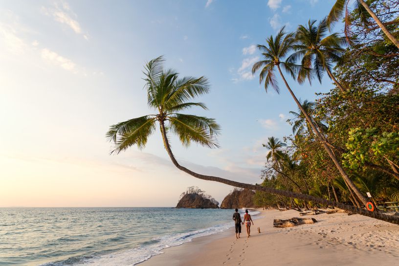 Couple walking on a beautiful beach in Costa Rica