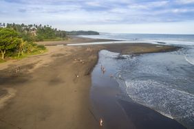 High-angle view of surfers and beachgoers on Balian Beach