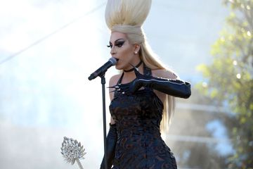 Drag queen Alaska performing outside in black outfit