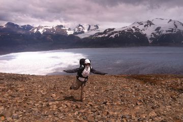 Amanda Machado in front of water and snowcapped mountains