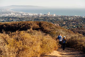 Hikers on Backbone Trail, with views of Santa Monica and Marina Del Rey