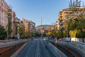 Barcelona street with tower in the background