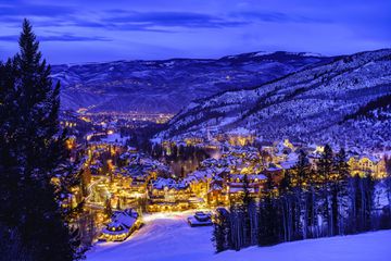 Beaver Creek Colorado Village at Night - Dusk view at twilight of village lights and town at night in winter looking down from ski slopes.