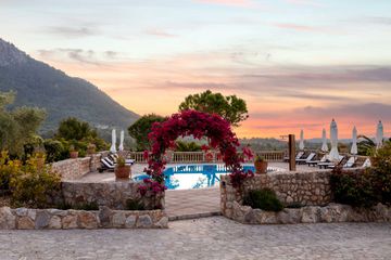 Pool and sunset at Can Beneit
