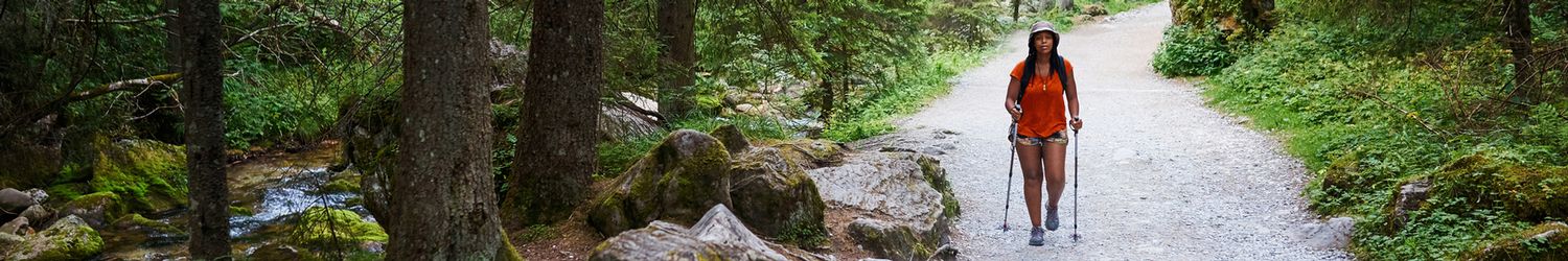 Person hiking along trail in nature