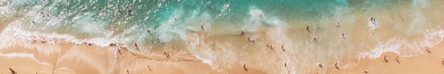 A beach in summer with a large amount of people