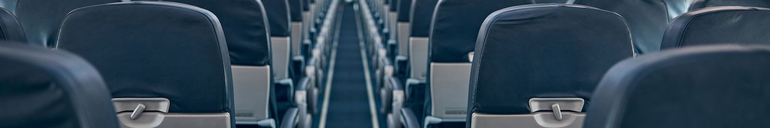 View of economy seats inside the coach cabin of airplane