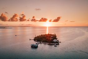 Aerial sunset view of Cayo Espanto private island