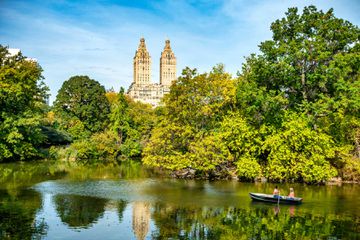 Beautiful lake with row boats in New York Central Park