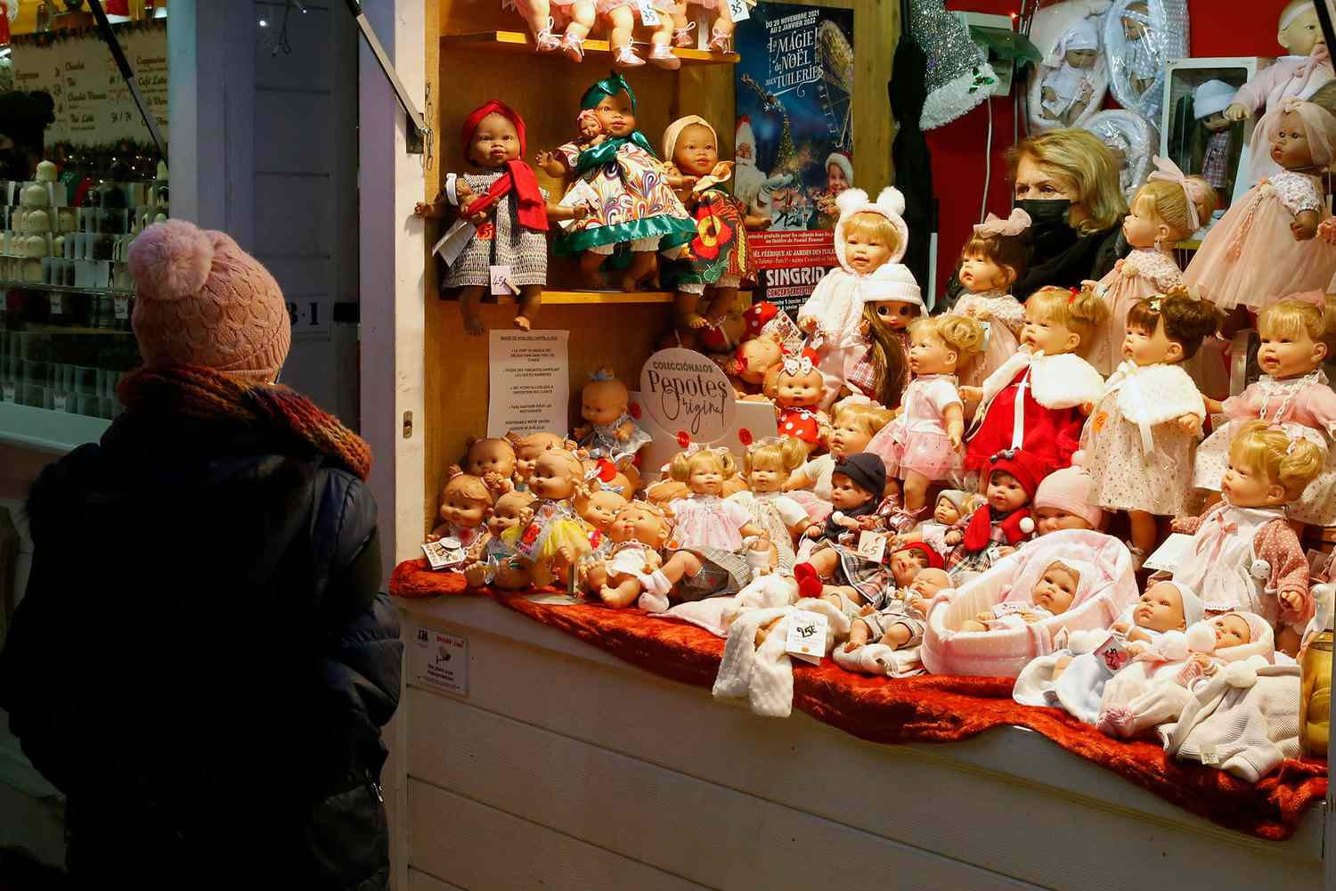A visitor at the Christmas market in Tuileries Garden in Paris, France.