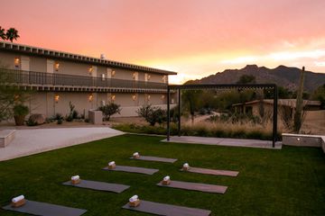 Outdoor yoga class at sunset