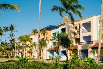 A row of colorful houses and palm trees in the Dominican Republic