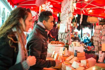 Couple shopping at food market in Milan