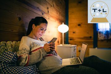 Young women enjoy her vacation. She is using laptop in holiday villa, shopping online. It is winter time.