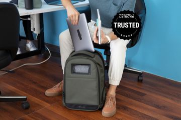 A person putting a laptop in a Solgarrd Lifepack