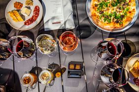 Four wines paired with a picnic basket of treats, including cheese and salami made with Martinis Napa Valley Cabernet, duck rillette, truffle popcorn and a wild mushroom and truffle pizza, in Martini Park, at Louis M. Martini Winery, in St. Helena, CA,