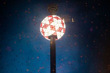 Confetti falls by the Times Square New Year’s Eve Ball during 2021 New Year's Eve celebration in Times Square on December 31, 2020 in New York City.