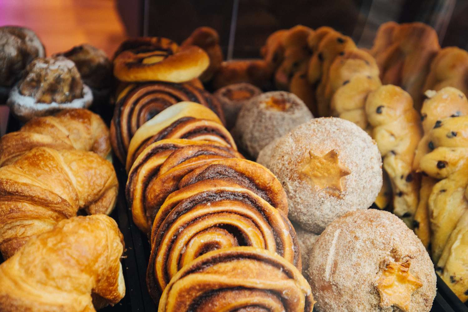 A variety of cakes and pastries on a boulangerie or patisserie market stall.