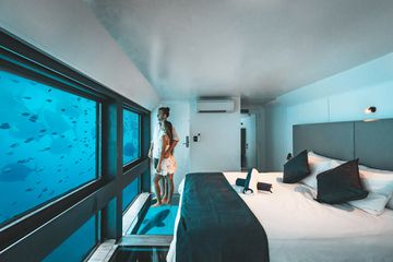 A couple in a reefsuite from Journey Beyond Cruise Whit Sundays