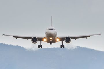 Low angle view of airplane against sky