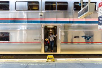 A family walking off an Amtrak Auto Train 