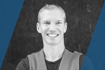 Black and white portrait of a person who is listed as an A List Travel Advisor 