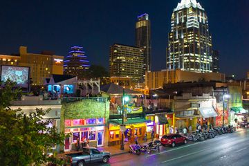 Night view of street with buildings of Austin.