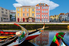 Cityscape in the city of Aveiro. Moliceiros boats in the Ria de Aveiro.