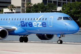 A Breeze Airways airplane on the tarmac at Tampa International Airport 