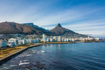 Aerial view of Sea Point, a wealthy suburb on Cape Town's Atlantic seaboard, In the background are Signal Hill, Lion's Head and Table Mountain. South Africa.