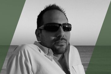 Black and white portrait of a person who is listed as an A List Travel Advisor 