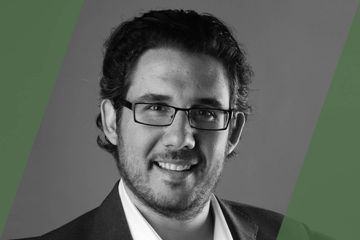 A black and white portrait of a person who is listed as an A List travel advisor/agent (names mentioned in text)