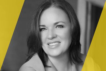 A black and white portrait of a person who is listed as an A List travel advisor/agent (names mentioned in text)