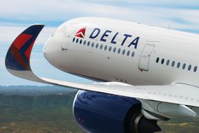 A Delta Airline A350 airbus flying over land
