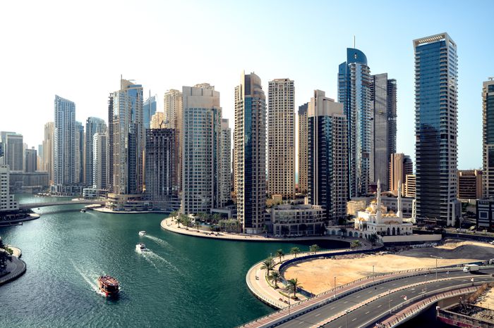 Aerial view of cityscape and skyscraper at sunset in Dubai Marina