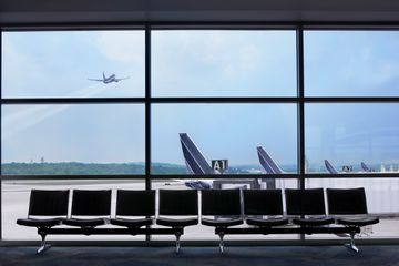 Airport waiting area, airplane taking off