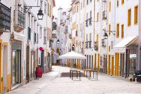 Street view with beautiful old residential buildings in the city of Evora in Portugal 