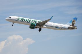 A Frontier Airlines flight takes off from Denver International Airport