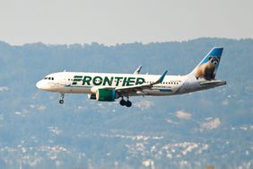  Frontier Airlines plane lands at San Francisco International Airport 