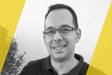 A black and white portrait of a person who is listed as an A List travel advisor/agent (names mentioned in text)