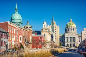 Downtown Harrisburg Pennsylvania USA on a sunny day, with the State Capitol Building in the background.