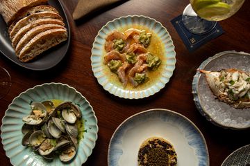A table with bread and seafood 