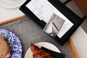 A Delta SkyMiles Platinum Business American Express Card on a cafe bill 