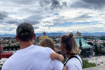 Family photo looking over scenic Mexico City 