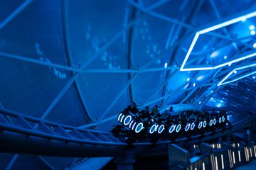 Guests on the TRON Lightcycle ride at Disney's Magic Kingdom Park