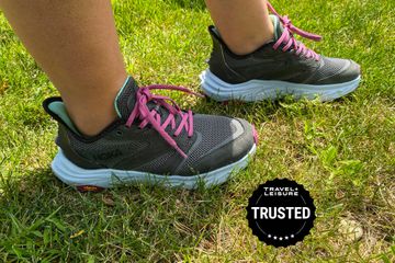 A person wearing the Hoka Women’s Anacapa 2 Freedom Trail Running Shoe