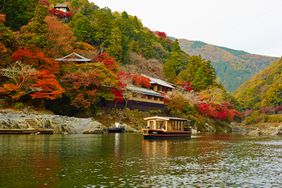 Boat in a river approaching Hoshinoya Kyoto