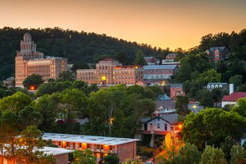 Hot Springs, Arkansas, USA town skyline from above at dawn.