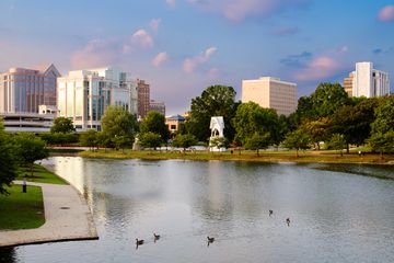Cityscape scene of downtown Huntsville, Alabama, from Big Spring Park at sunset