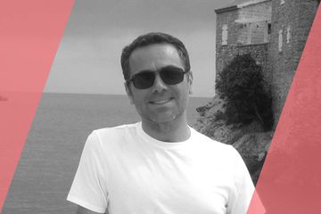 A black and white (grayscale) portrait of a person listed in the text as A List Travel Advisor